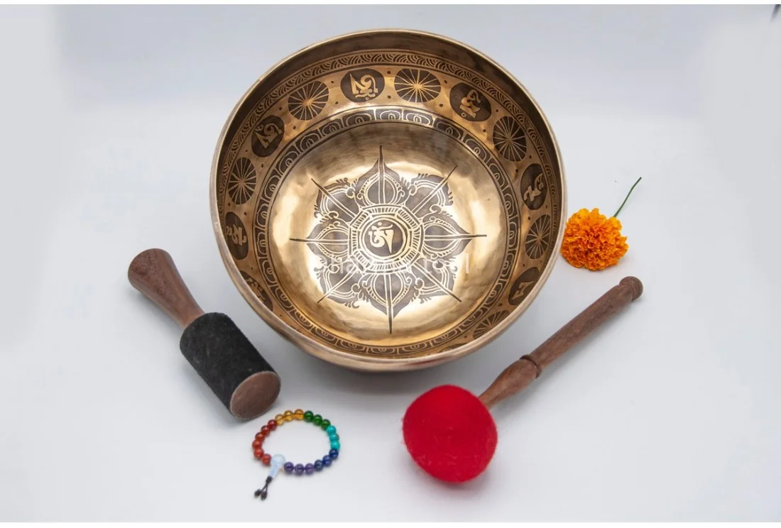 Lotus flower carved Tibetan singing bowl — symbol of purity and awakening Lotus flower etched at the centre of a handmade Tibetan singing bowl from Nepal