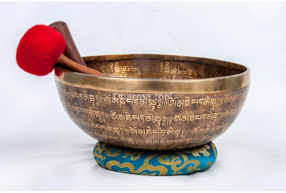 Om Mani Padme Hum mantra carved singing bowl with Dorje engraving Om Mani Padme Hum mantra etched around a Tibetan singing bowl with Dorje carving, hand-forged in Nepal
