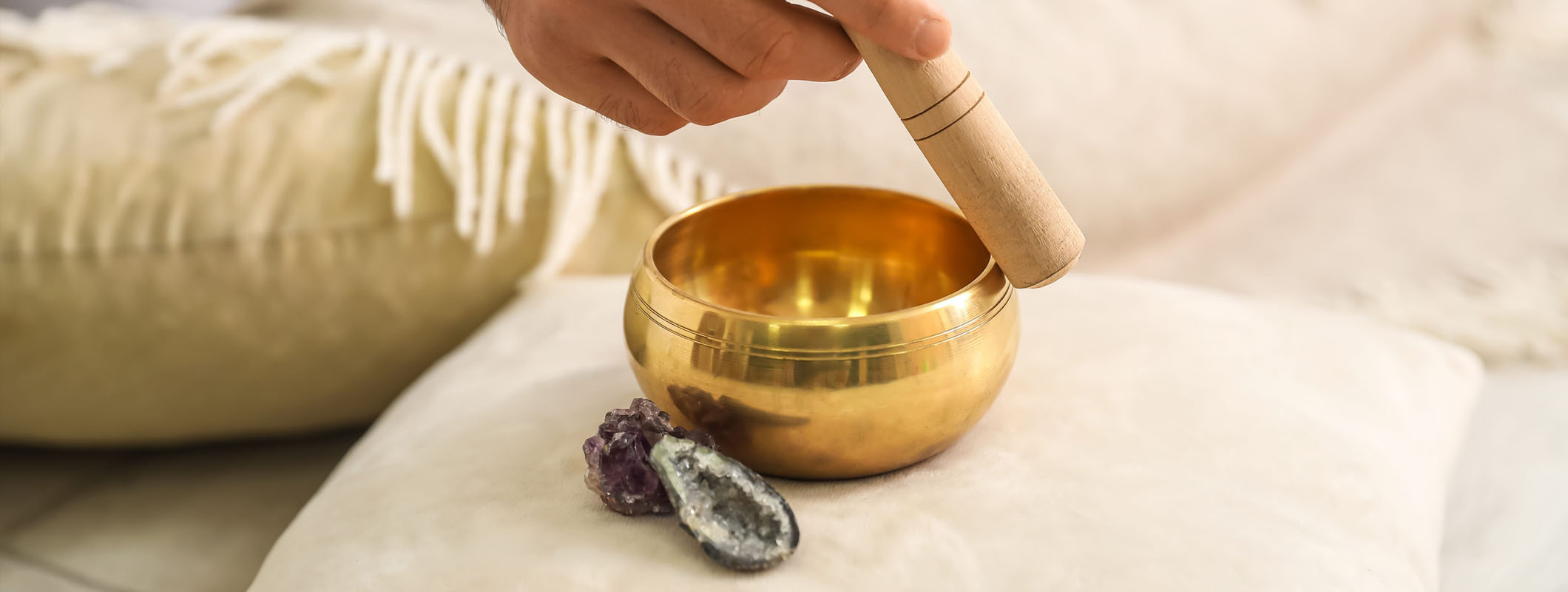 Charging stones and crystals with singing bowls