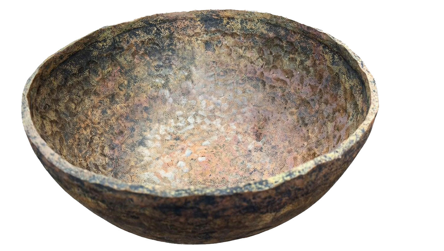 Raw hand forged Tibetan and Himalayan singing bowl showing natural hammered texture before final polishing