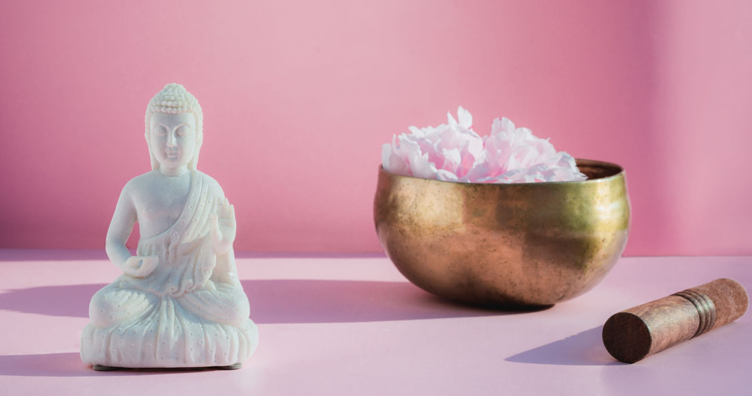 Tibetan singing bowl with Buddha statue setup