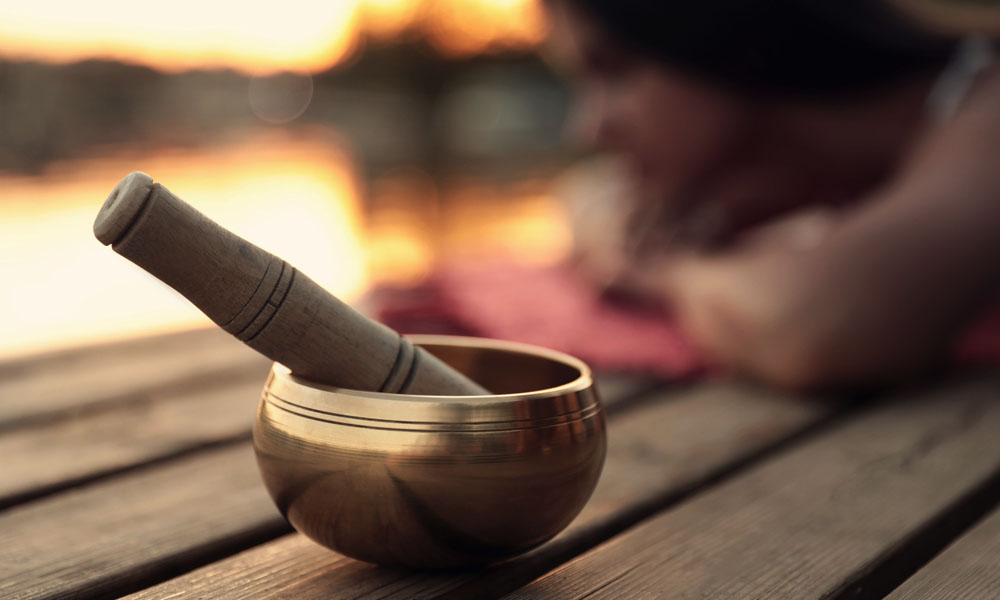 Singing bowls and mindfulness practice through present-moment listening and awareness