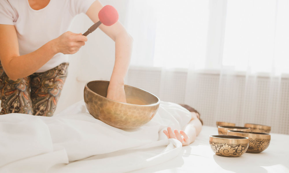 Singing bowl used in massage therapy to support relaxation through gentle vibration