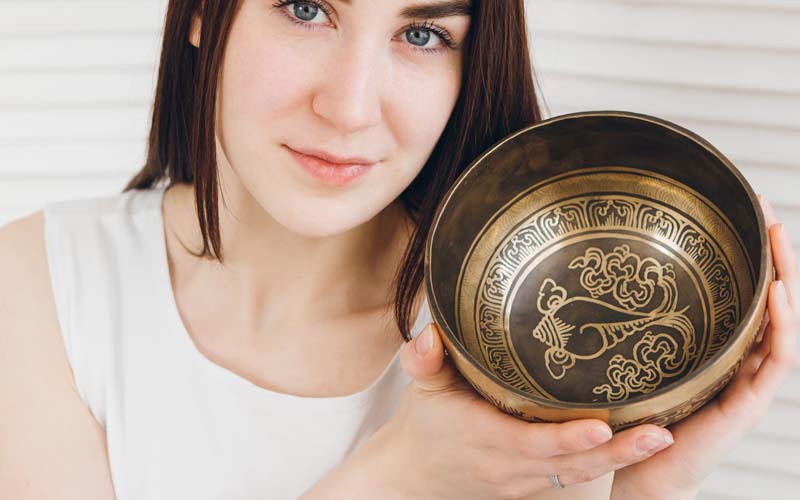 Mantra Etched Tibetan Singing Bowl Mantra etched Tibetan singing bowl with sacred symbols and acid etched spiritual artwork on a Himalayan singing bowl