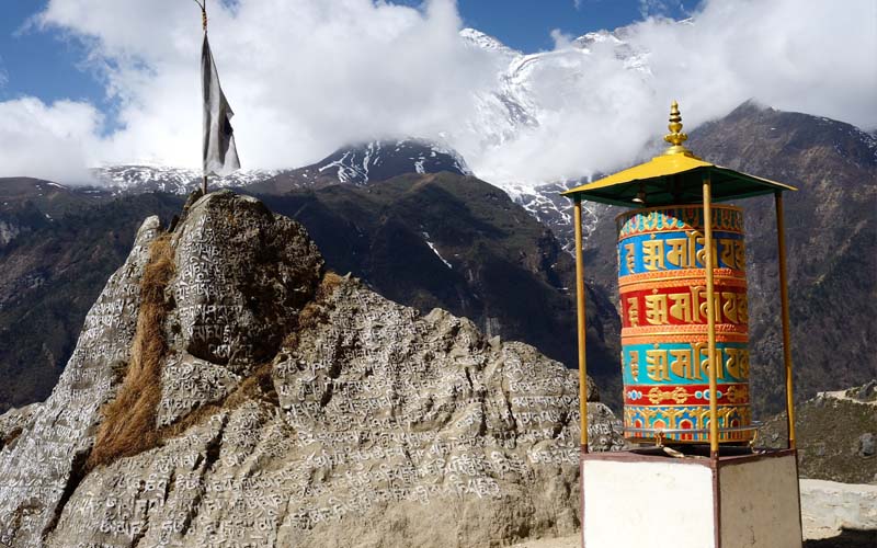 Tibetan prayer wheel spiritual benefits for meditation, peace, blessings, and positive energy