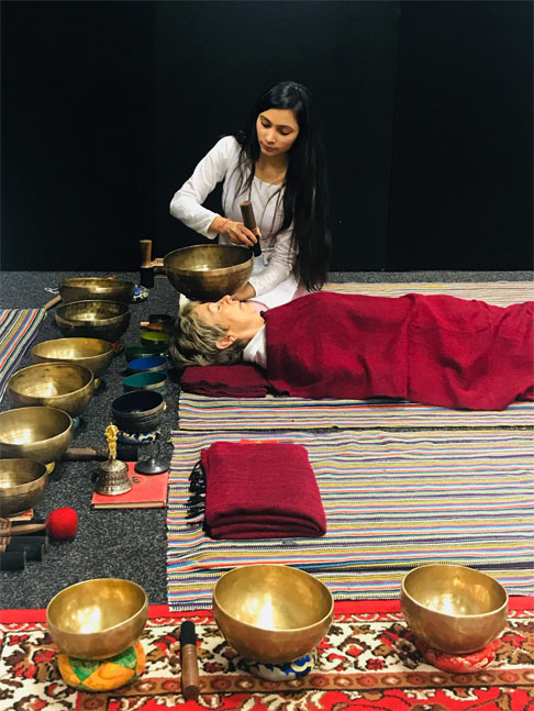 Sunita doing sound healing